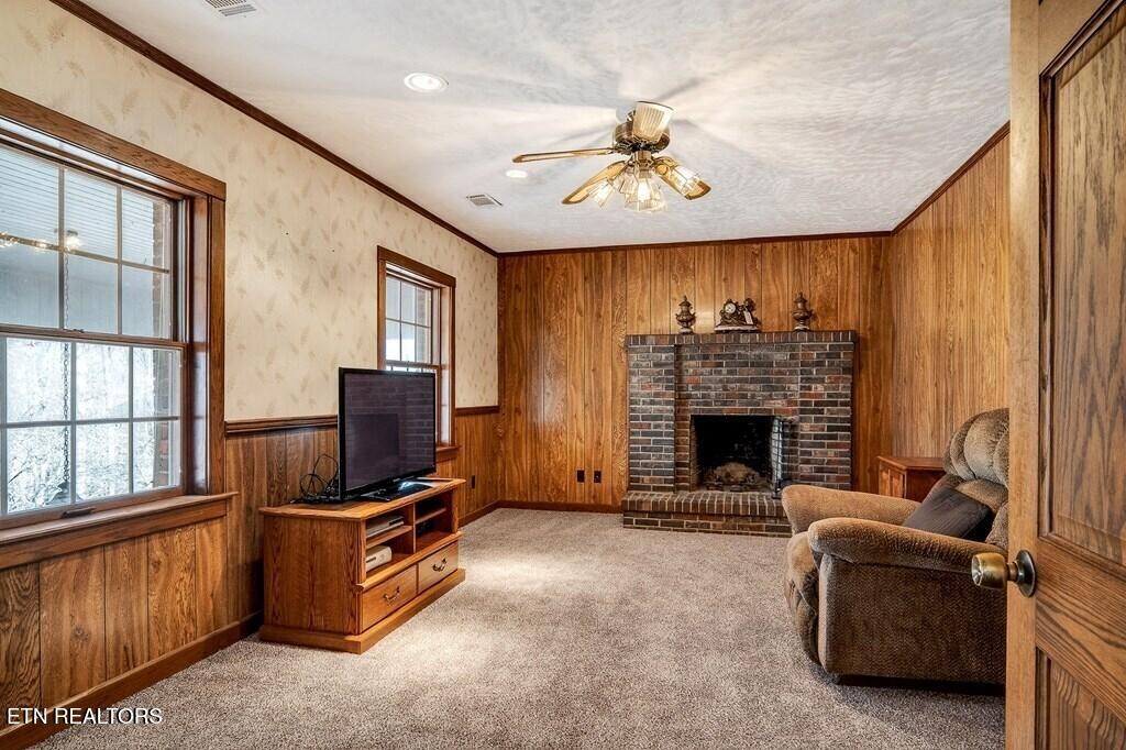 6211 Rocky Point Road Cookeville, TN 38506 - Photo 37 of 59 a view of a livingroom with furniture and a fireplace