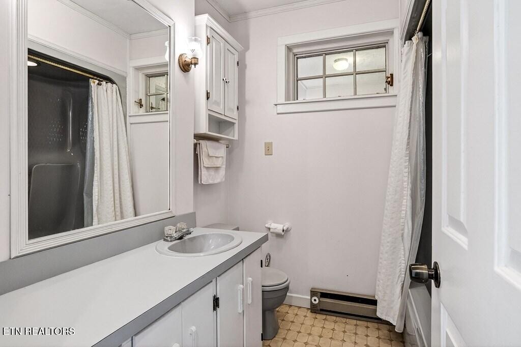 6211 Rocky Point Road Cookeville, TN 38506 - Photo 43 of 59 a bathroom with a sink toilet and shower