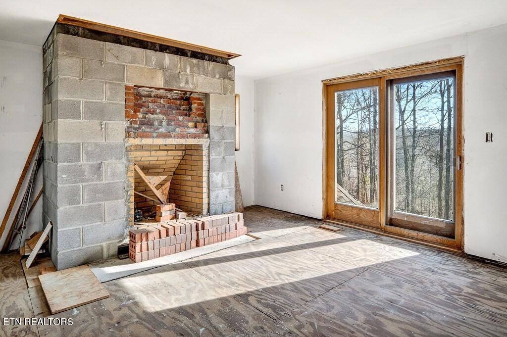6211 Rocky Point Road Cookeville, TN 38506 - Photo 52 of 59 a view of a room with a wooden floor and door