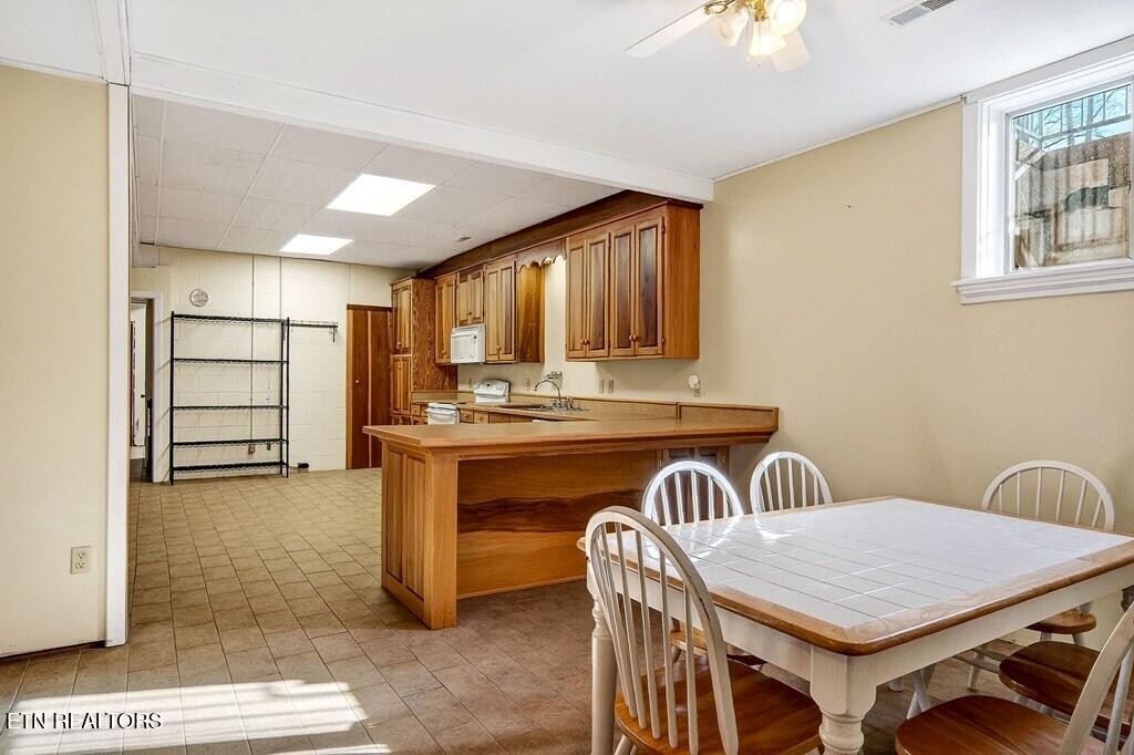 6211 Rocky Point Road Cookeville, TN 38506 - Photo 56 of 59 a dinning room with a table and chairs