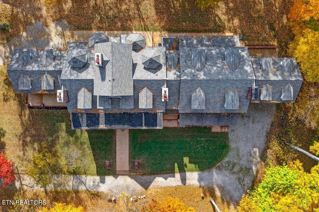 6211 Rocky Point Road Cookeville, TN 38506 - Photo 9 of 59 a aerial view of a house with a yard and large tree