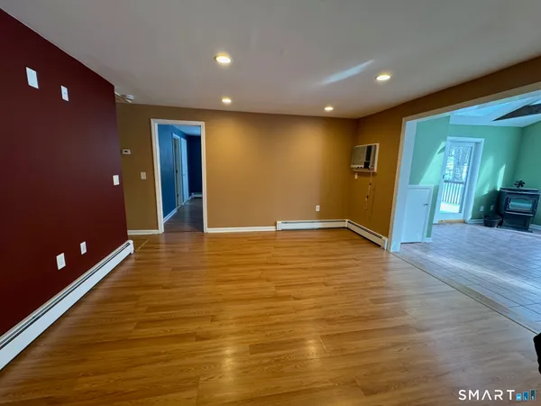 a view of a lobby room with wooden floor