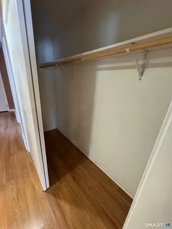 an empty room with wooden floor