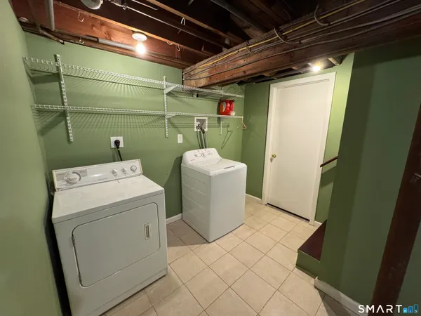 a view of a livingroom with an empty space and car windows