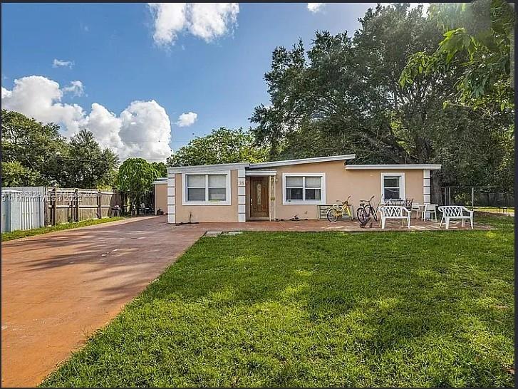 35 Virginia Road, Unit 1 West Park, FL 33023 - Photo 10 of 10 a front view of house with yard and green space
