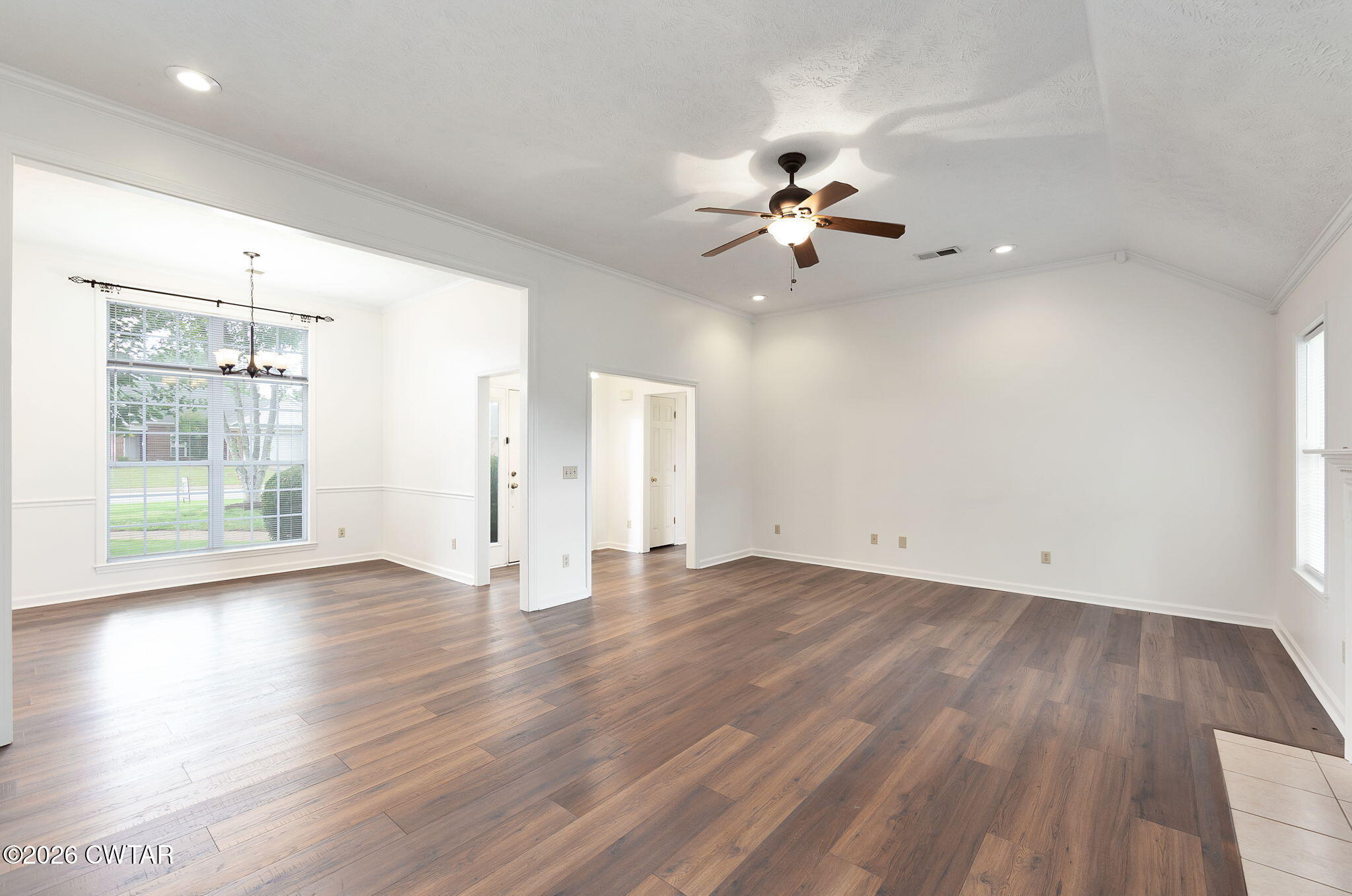 96 Sundown Drive Jackson, TN 38305 - Photo 5 of 28 a view of an empty room with wooden floor and a window