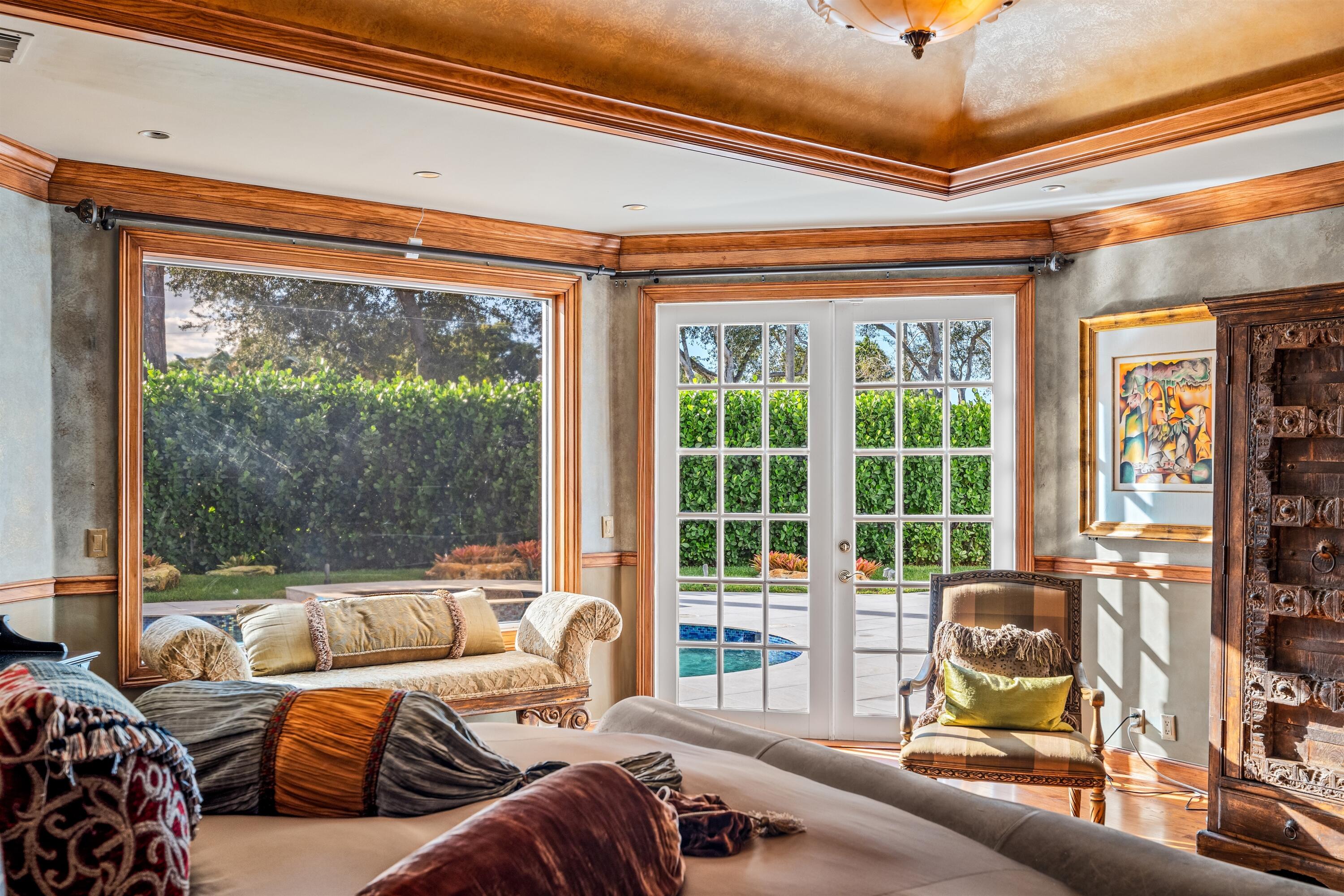 4475 Northwest 24th Terrace Boca Raton, FL 33431 - Photo 11 of 17 a living room with furniture and a floor to ceiling window