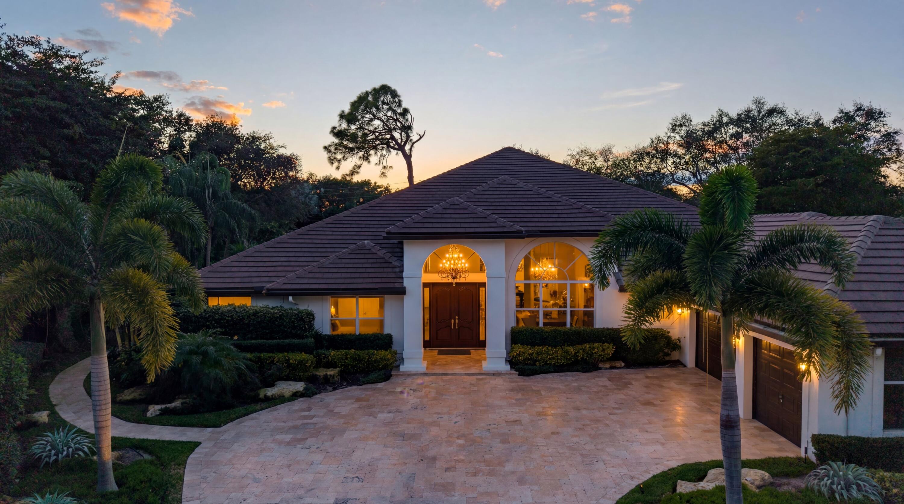 4475 Northwest 24th Terrace Boca Raton, FL 33431 - Photo 2 of 17 a front view of a house with garden