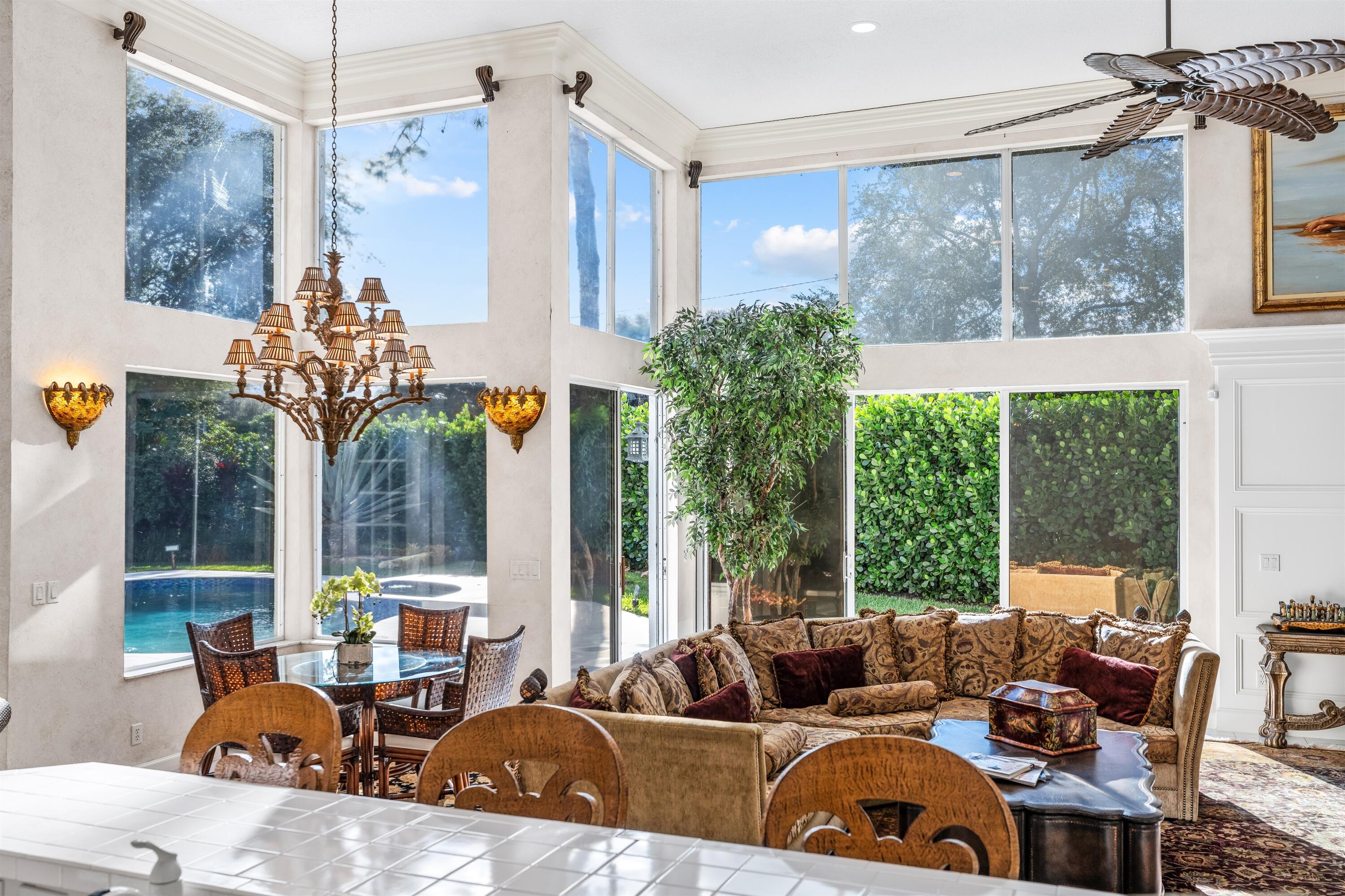 4475 Northwest 24th Terrace Boca Raton, FL 33431 - Photo 9 of 17 a living room with furniture and a large window