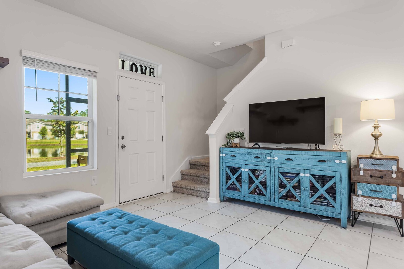 86784 Mainline Road Yulee, FL 32097 - Photo 7 of 25 a living room with furniture and a flat screen tv