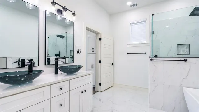 a bathroom with a double vanity sink and mirror