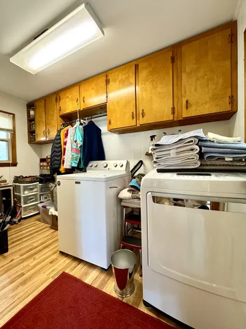 a utility room with washer and dryer
