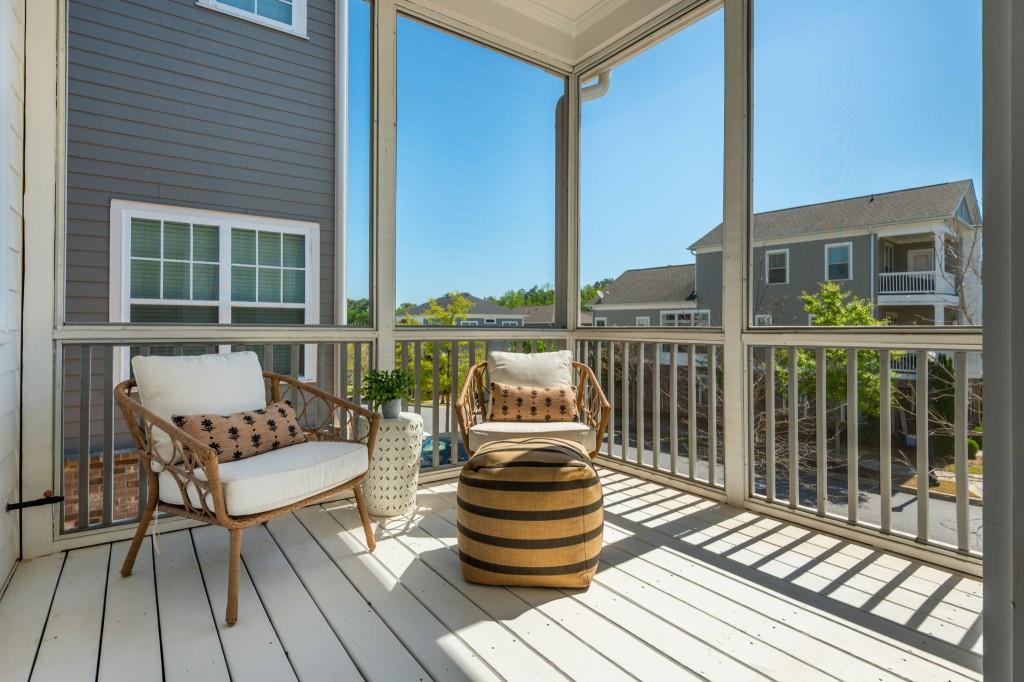 595 Hanlon Way Alpharetta, GA 30009 - Photo 15 of 33 a balcony with wooden floor table and chairs
