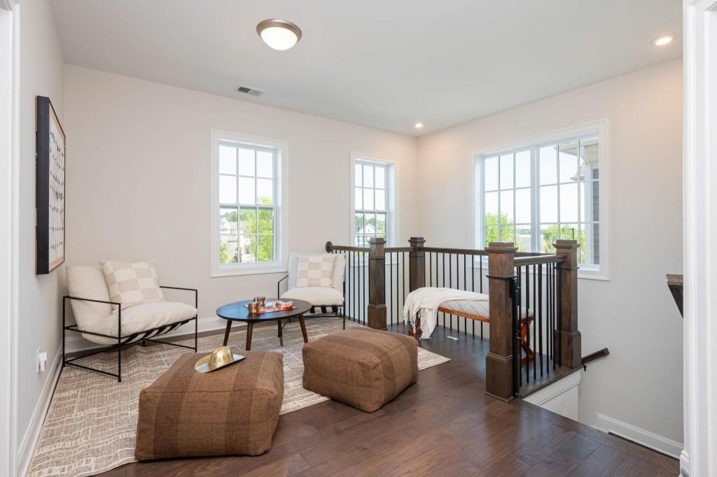 595 Hanlon Way Alpharetta, GA 30009 - Photo 16 of 33 a living room with furniture and two windows