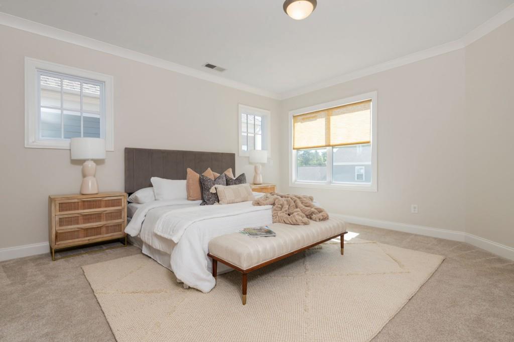 595 Hanlon Way Alpharetta, GA 30009 - Photo 17 of 33 a bed room with a bed and a window