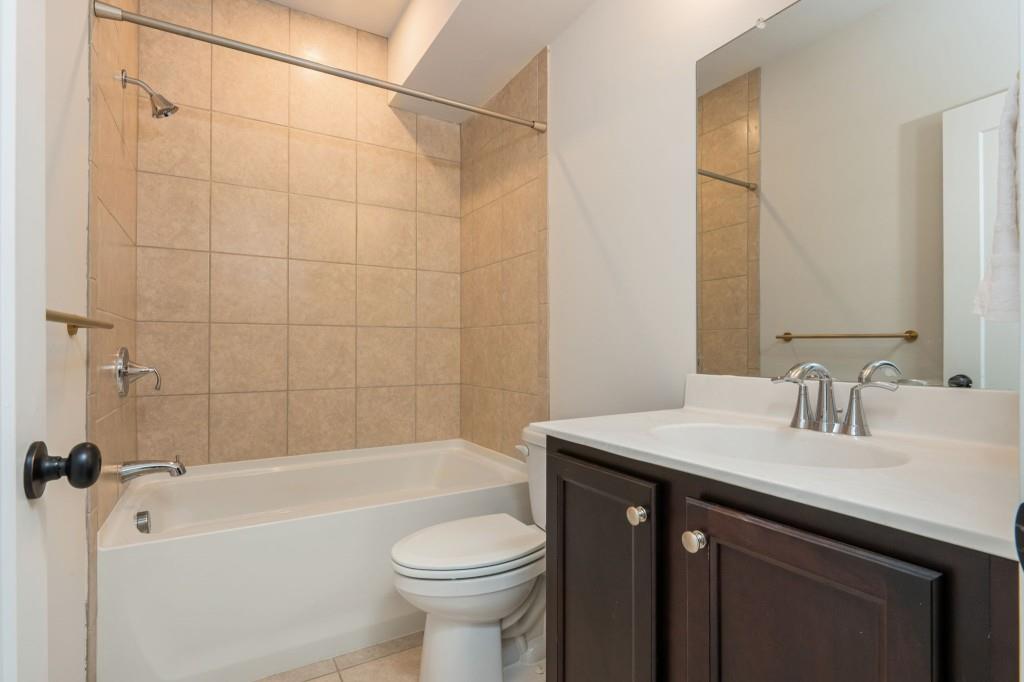595 Hanlon Way Alpharetta, GA 30009 - Photo 25 of 33 a bathroom with a sink a toilet and shower
