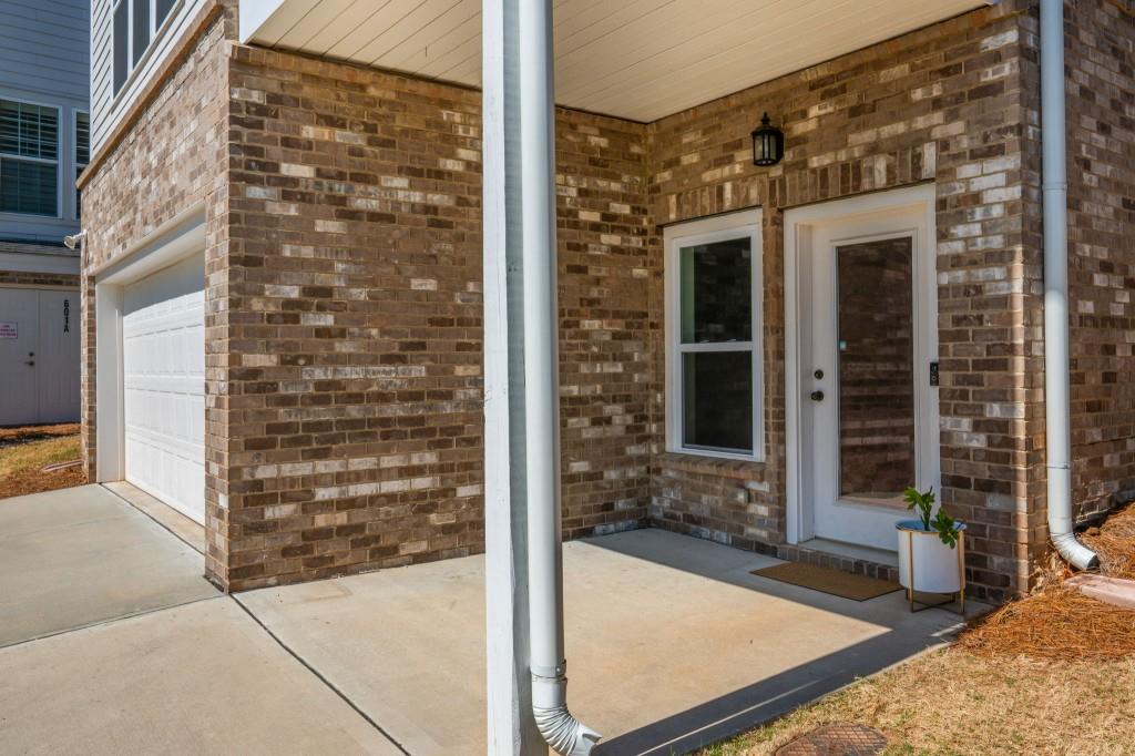 595 Hanlon Way Alpharetta, GA 30009 - Photo 27 of 33 front view of a house with a glass door