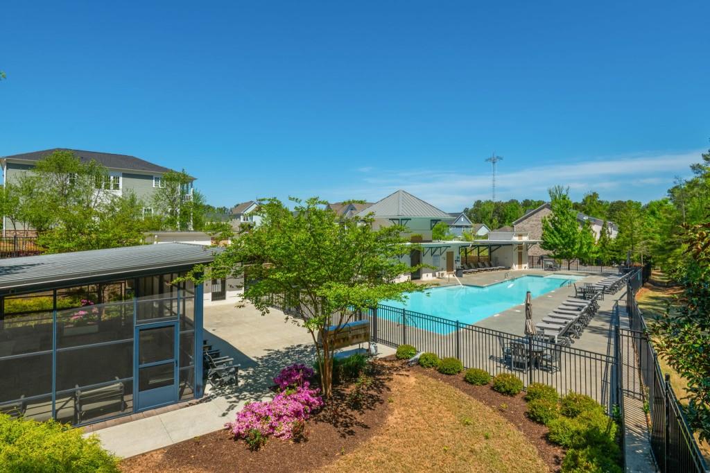 595 Hanlon Way Alpharetta, GA 30009 - Photo 29 of 33 a backyard of a house with table and chairs