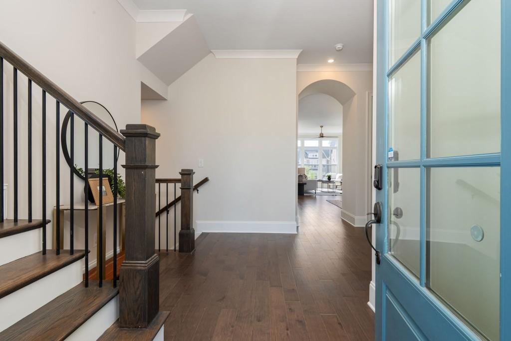 595 Hanlon Way Alpharetta, GA 30009 - Photo 4 of 33 a view of a hallway view with wooden floor and staircase