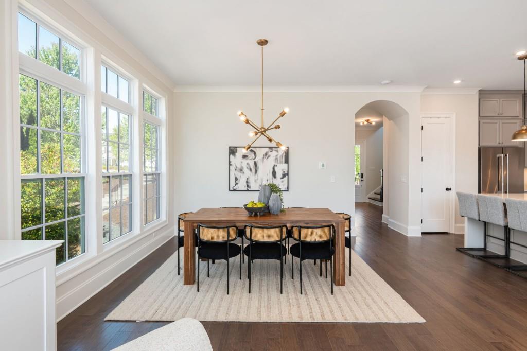 595 Hanlon Way Alpharetta, GA 30009 - Photo 7 of 33 a view of a dining room with furniture window and wooden floor