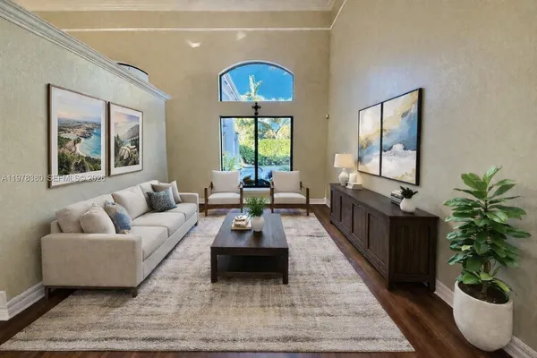 a living room with furniture and a large mirror