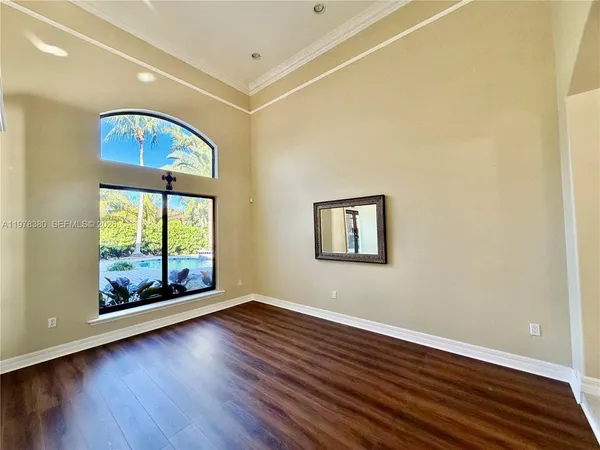 a kitchen with stainless steel appliances granite countertop a refrigerator a sink dishwasher and wooden cabinets