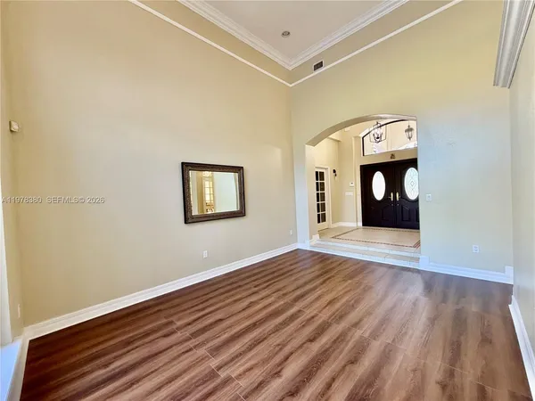 a kitchen with stainless steel appliances wooden cabinets stove and a sink