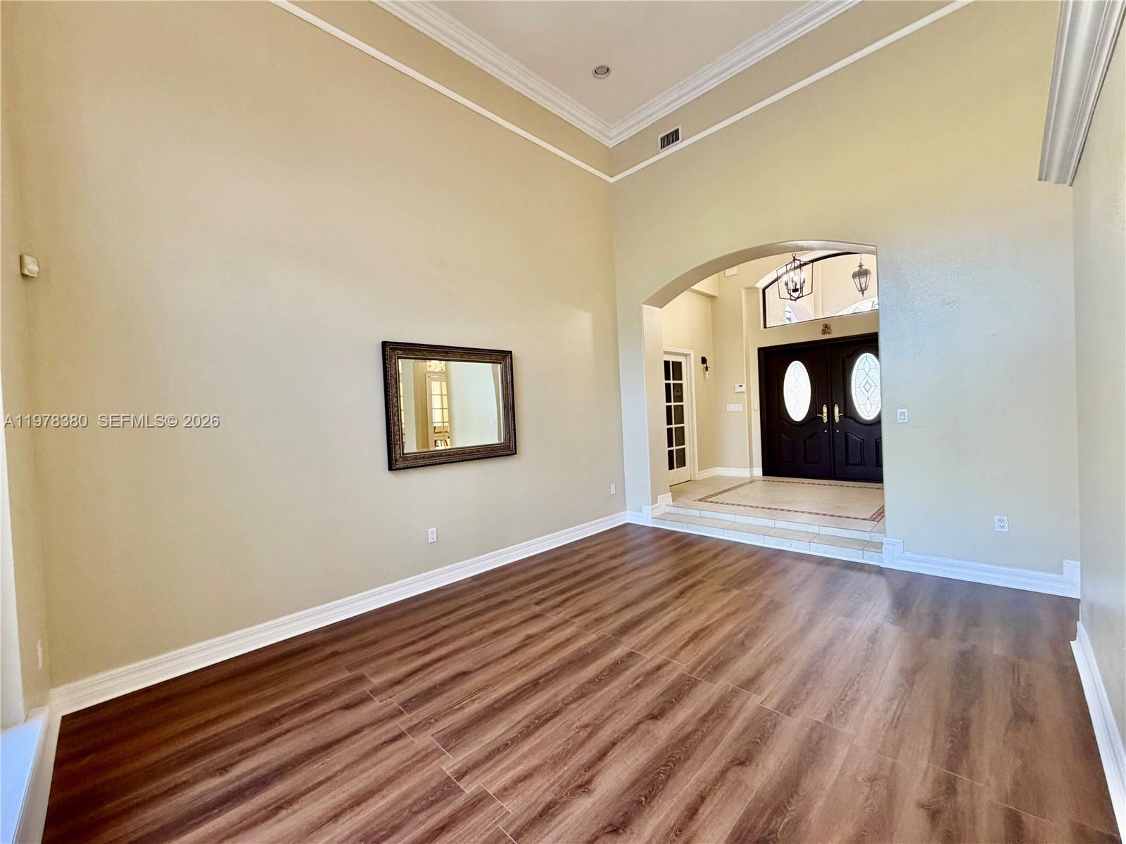 12391 Southwest 75th Street Miami, FL 33183 - Photo 17 of 89 a view of empty room with wooden floor