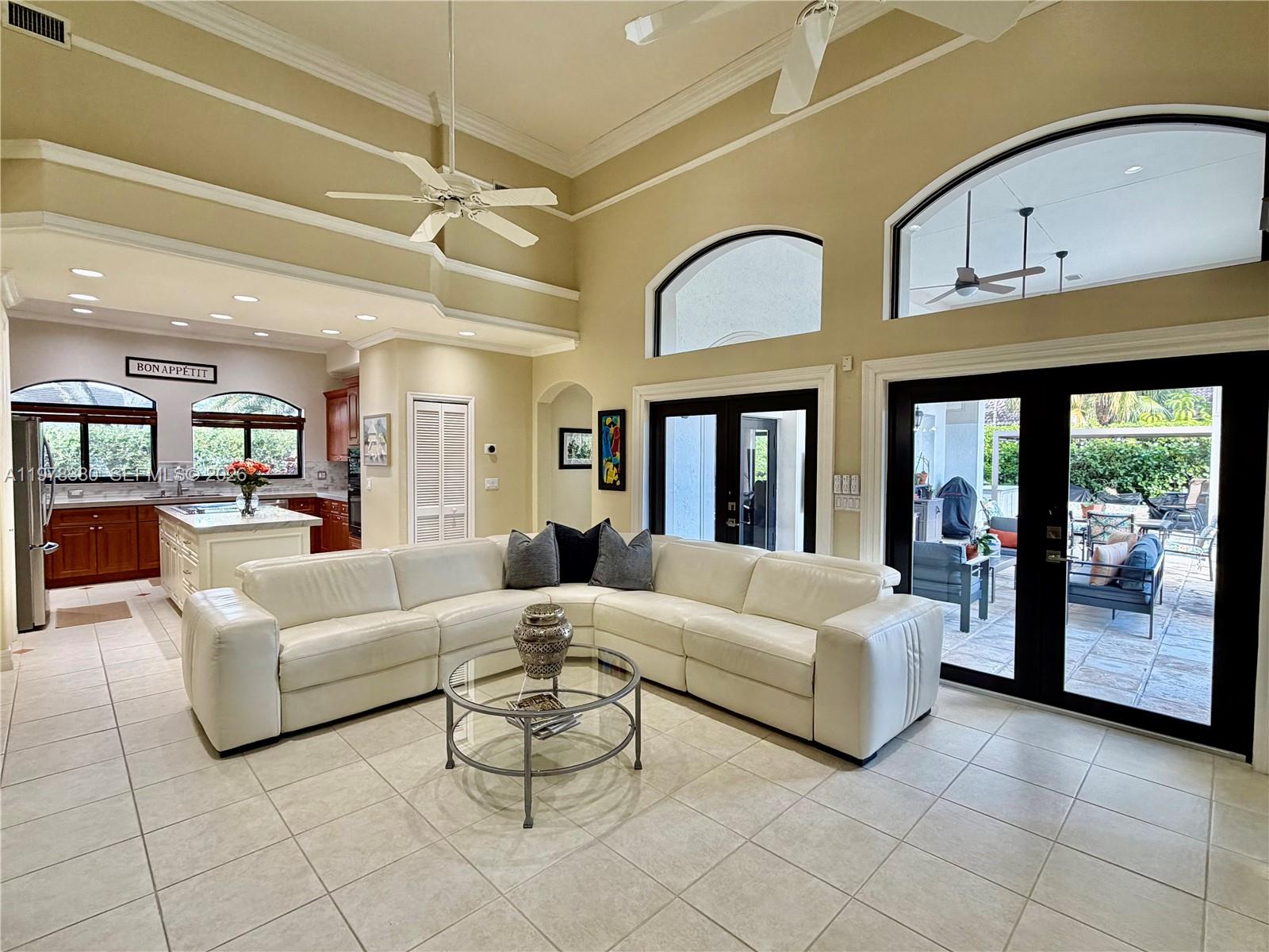 12391 Southwest 75th Street Miami, FL 33183 - Photo 21 of 89 a living room with furniture and large windows