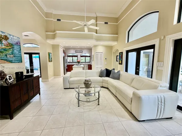 a spacious bedroom with a large bed and a flat screen tv