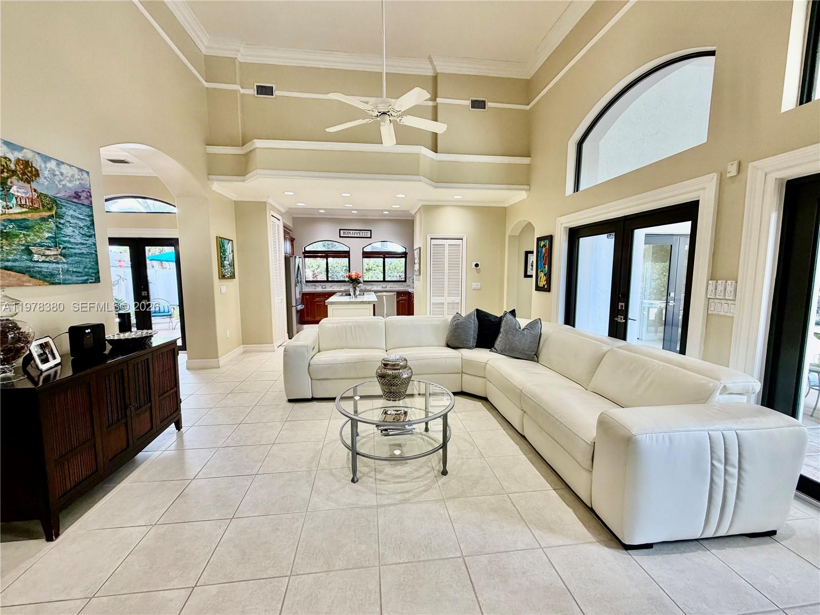 12391 Southwest 75th Street Miami, FL 33183 - Photo 22 of 89 a living room with furniture and a large mirror