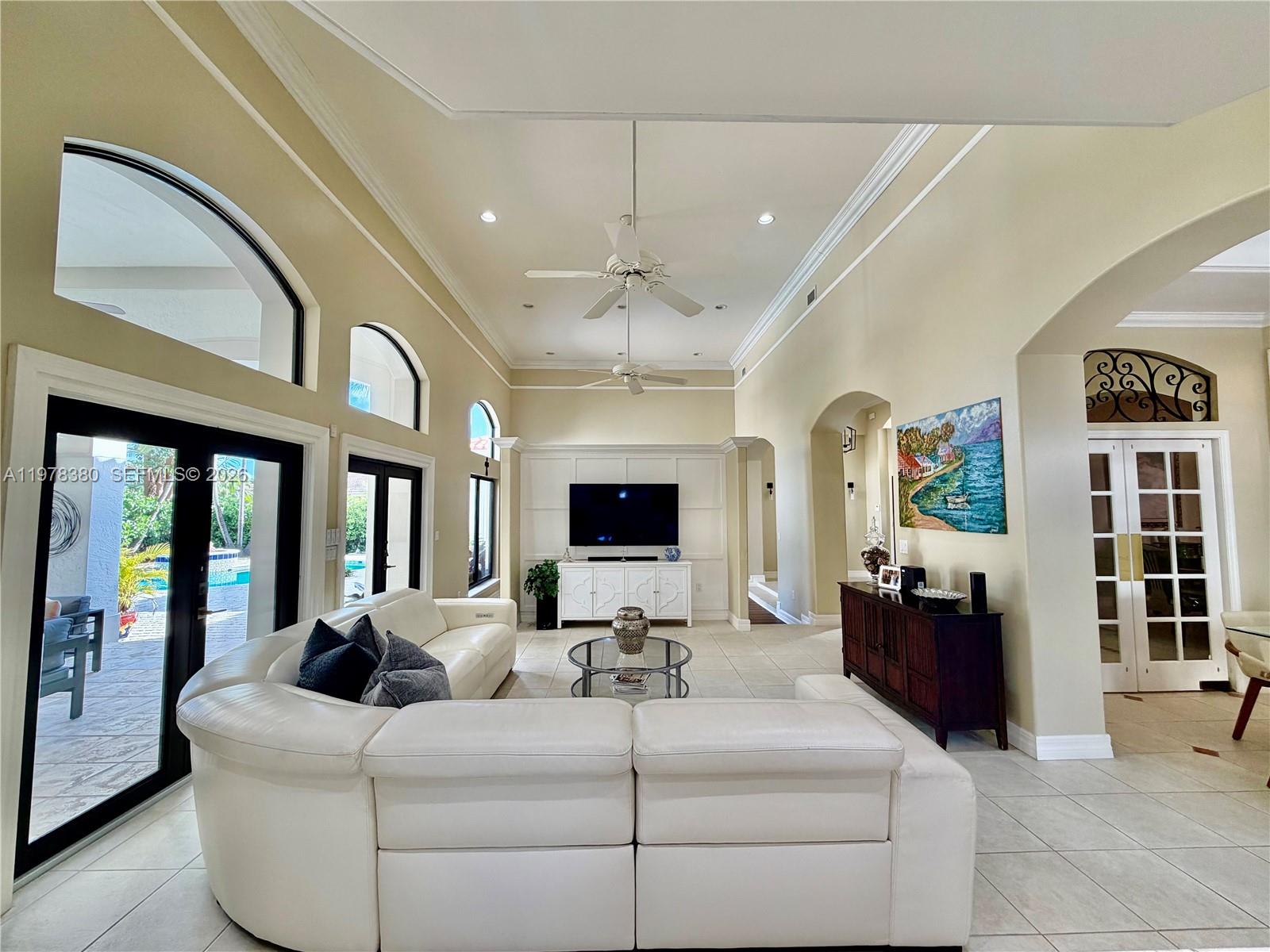 12391 Southwest 75th Street Miami, FL 33183 - Photo 23 of 89 a living room with furniture and a flat screen tv