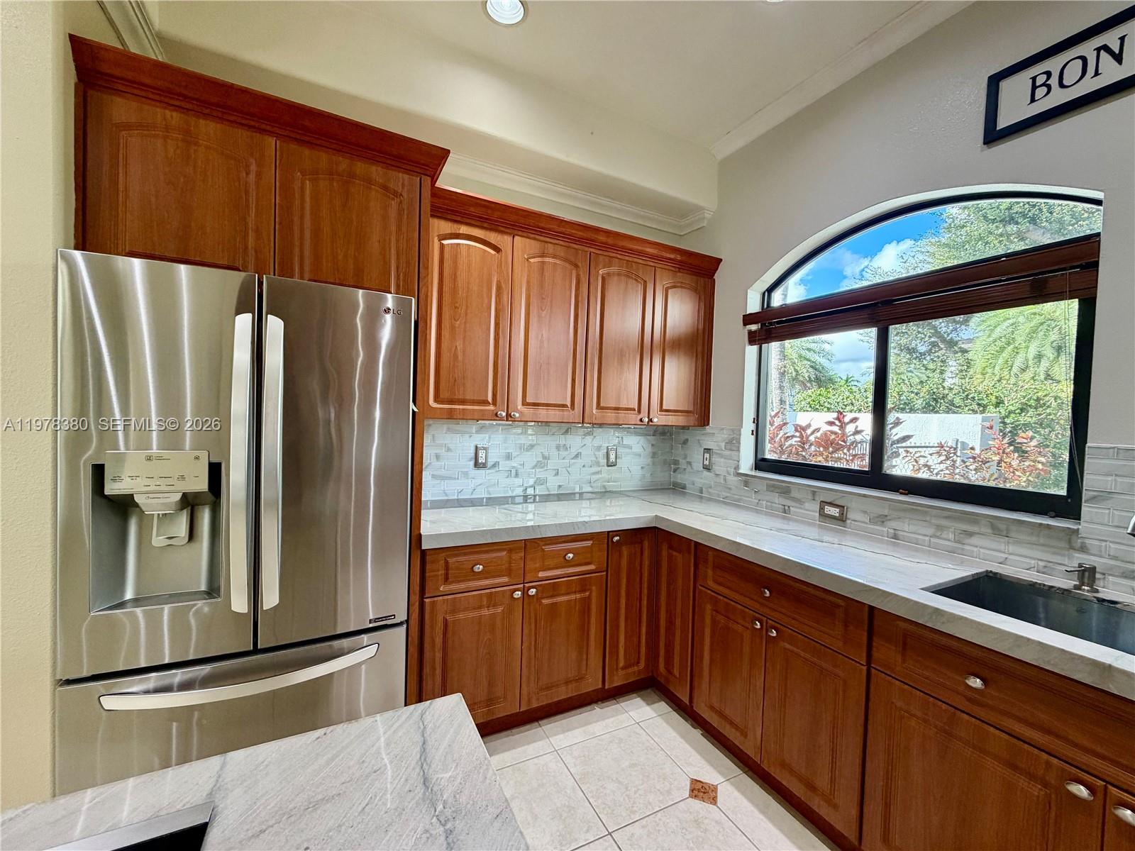 12391 Southwest 75th Street Miami, FL 33183 - Photo 29 of 89 a kitchen with stainless steel appliances granite countertop a refrigerator and a sink