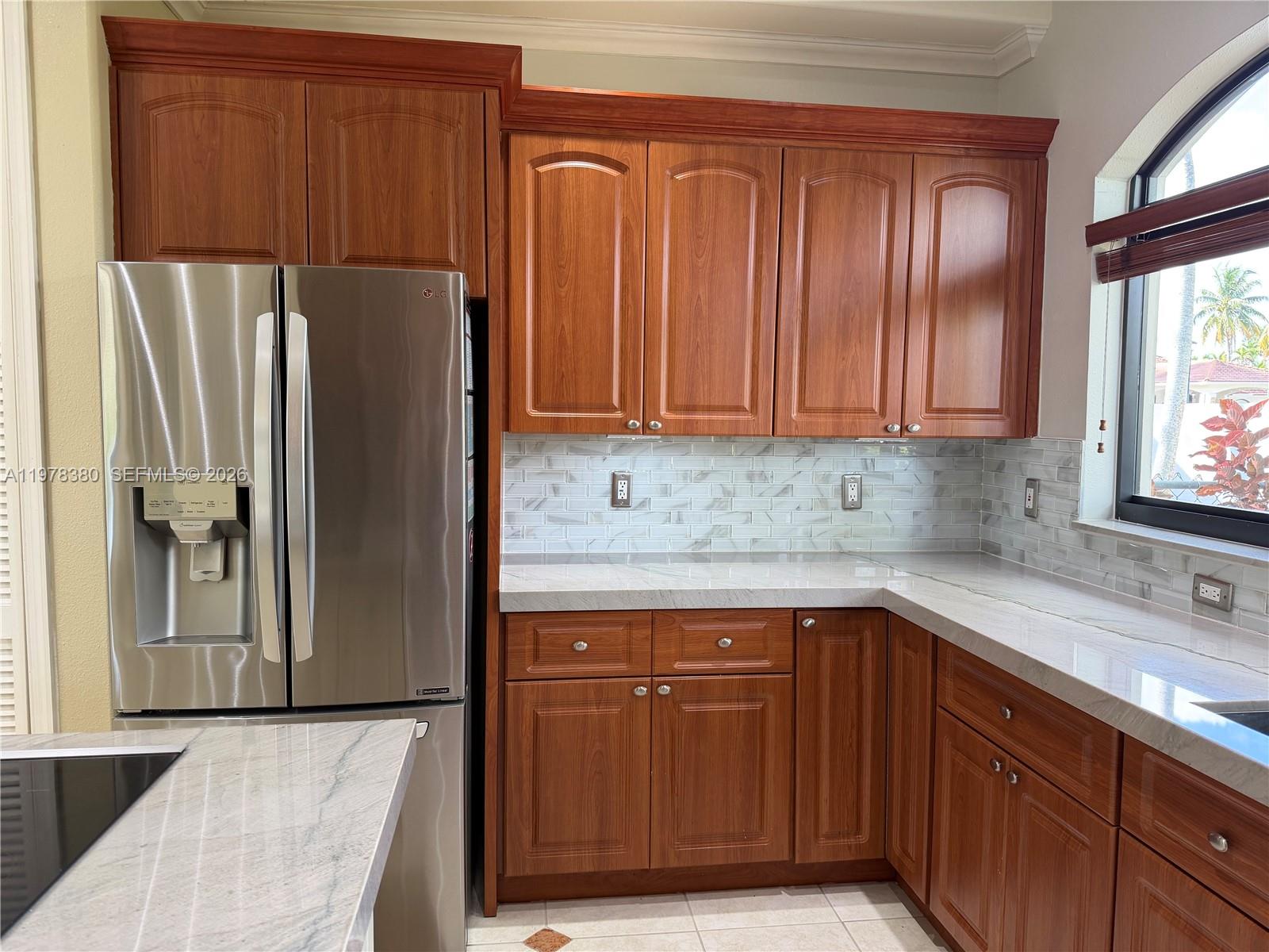 12391 Southwest 75th Street Miami, FL 33183 - Photo 30 of 89 a kitchen with stainless steel appliances granite countertop a refrigerator and a sink
