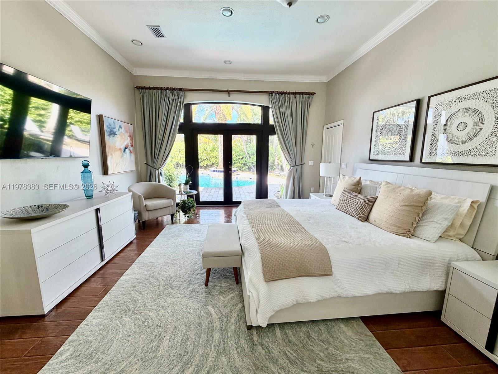 12391 Southwest 75th Street Miami, FL 33183 - Photo 34 of 89 a bedroom with a large bed and a large window