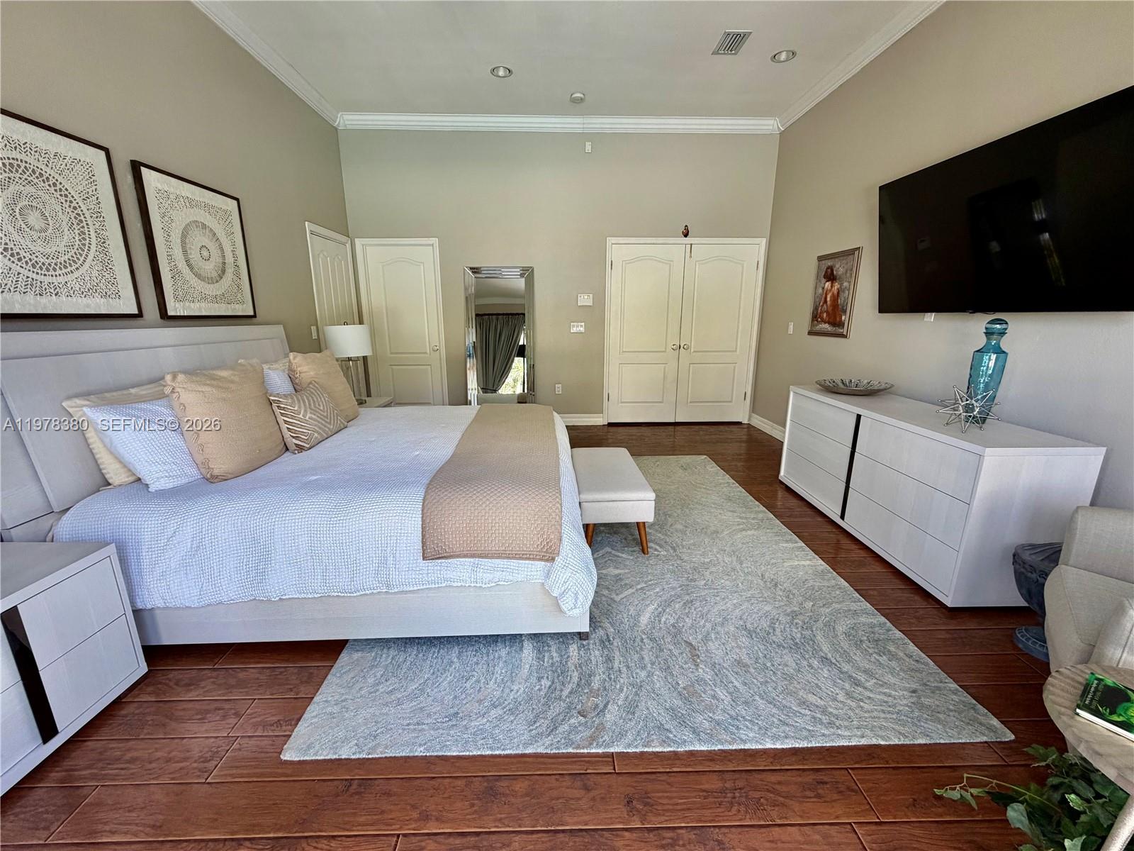 12391 Southwest 75th Street Miami, FL 33183 - Photo 39 of 89 a living room with furniture and a flat screen tv