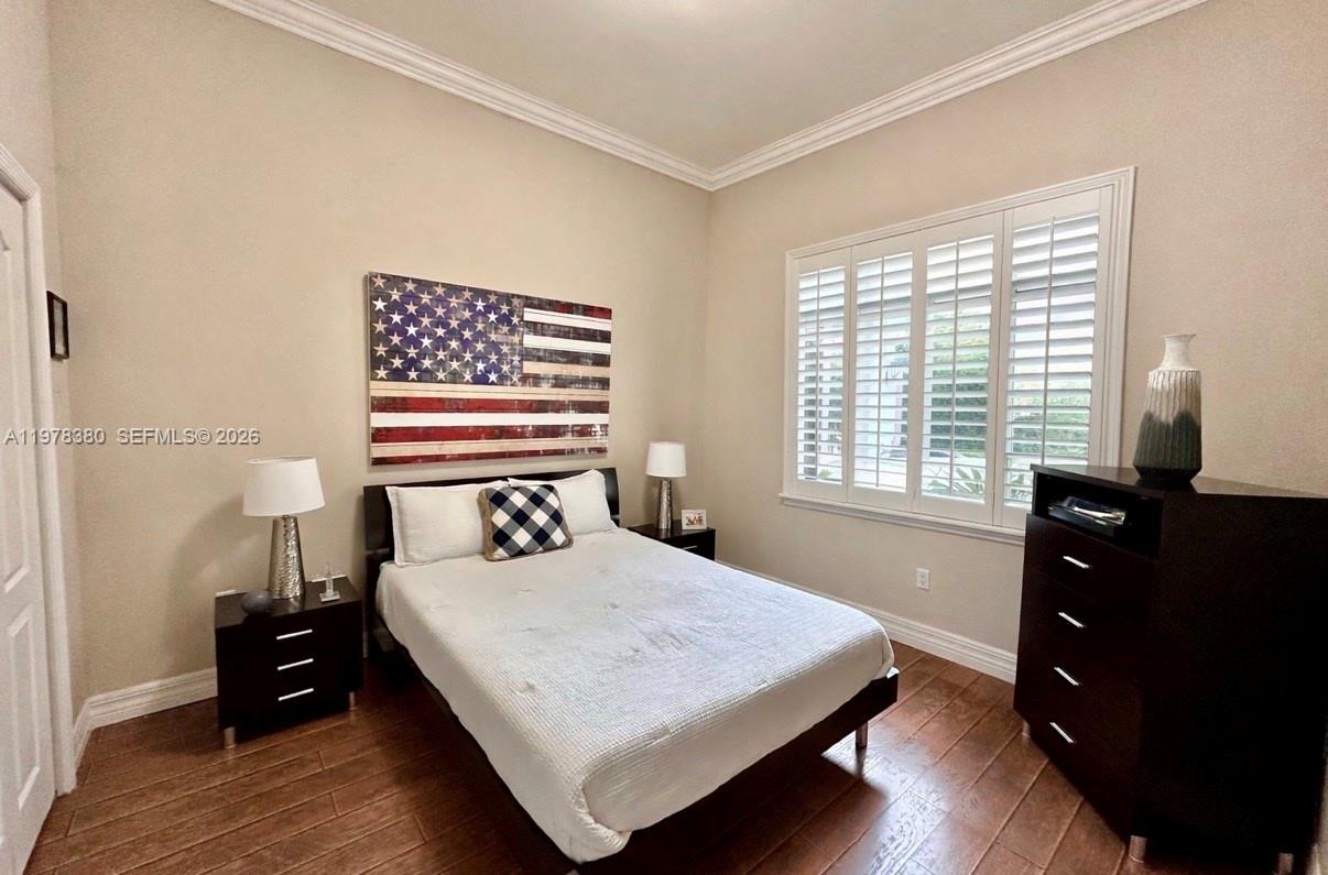 12391 Southwest 75th Street Miami, FL 33183 - Photo 47 of 89 a bedroom with a bed and a window