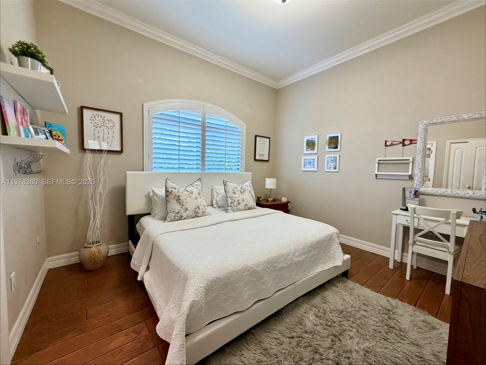 12391 Southwest 75th Street Miami, FL 33183 - Photo 50 of 89 a bedroom with a bed and a wooden floor