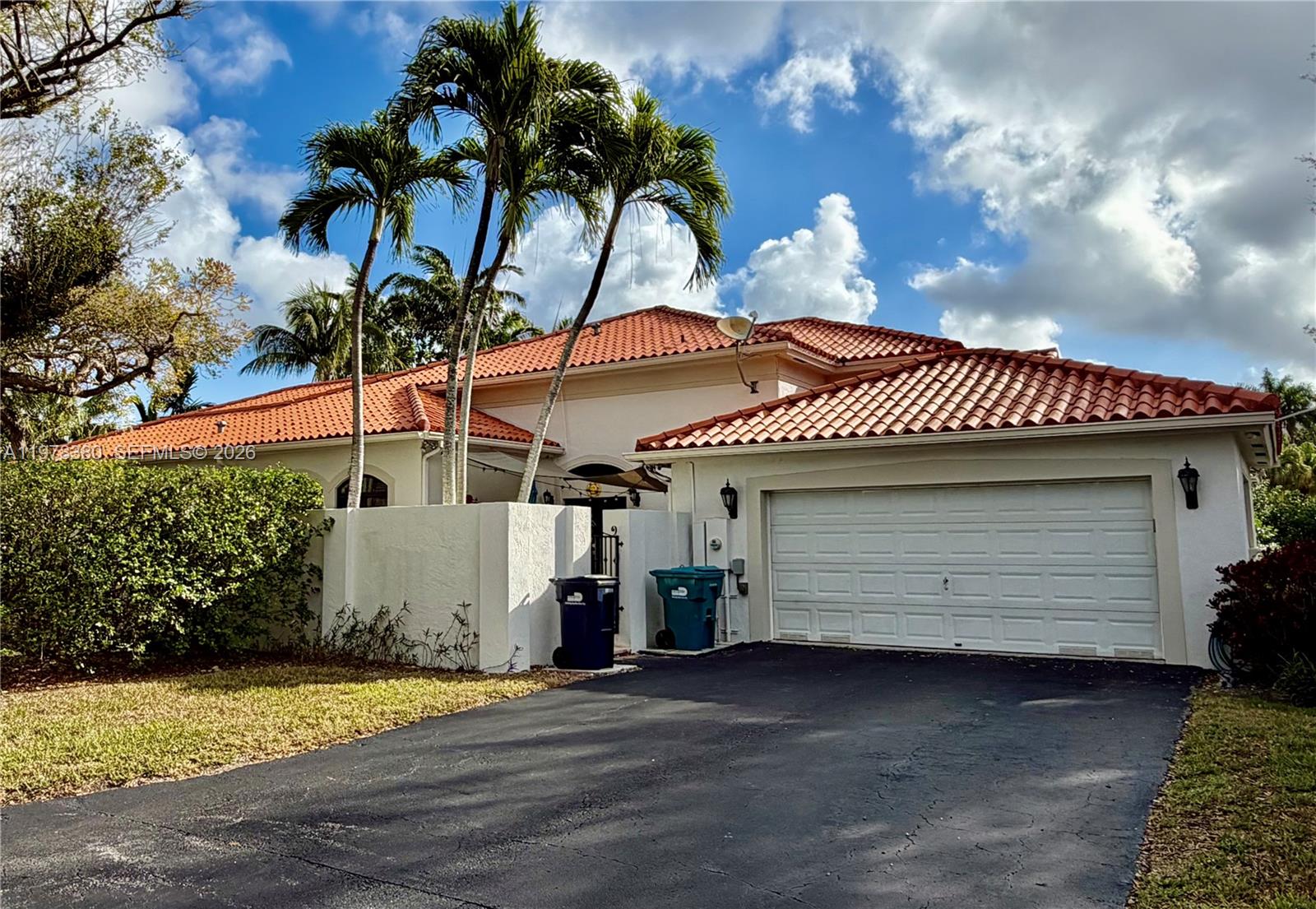 12391 Southwest 75th Street Miami, FL 33183 - Photo 5 of 89 a front view of a house with a garden