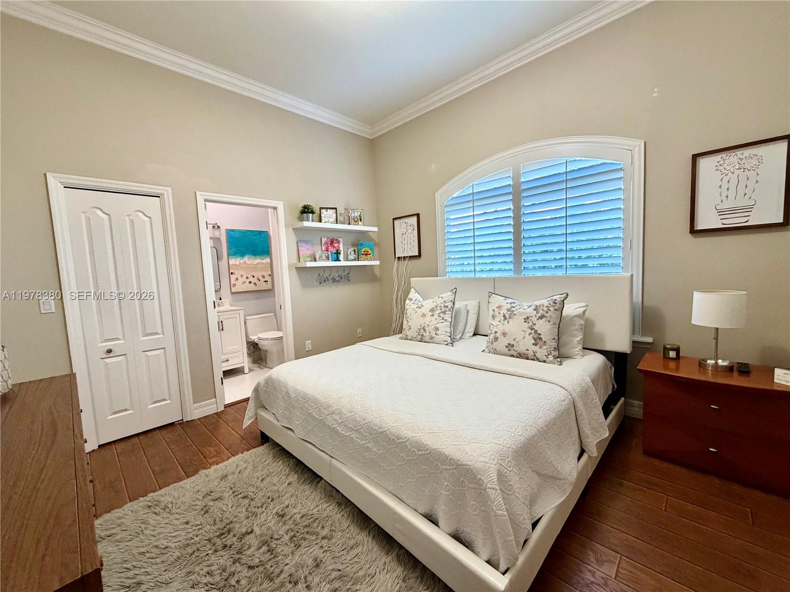 12391 Southwest 75th Street Miami, FL 33183 - Photo 51 of 89 a bedroom with a bed and wooden floor