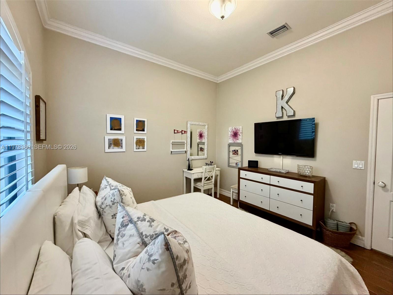 12391 Southwest 75th Street Miami, FL 33183 - Photo 52 of 89 a bedroom with a bed and a flat screen tv