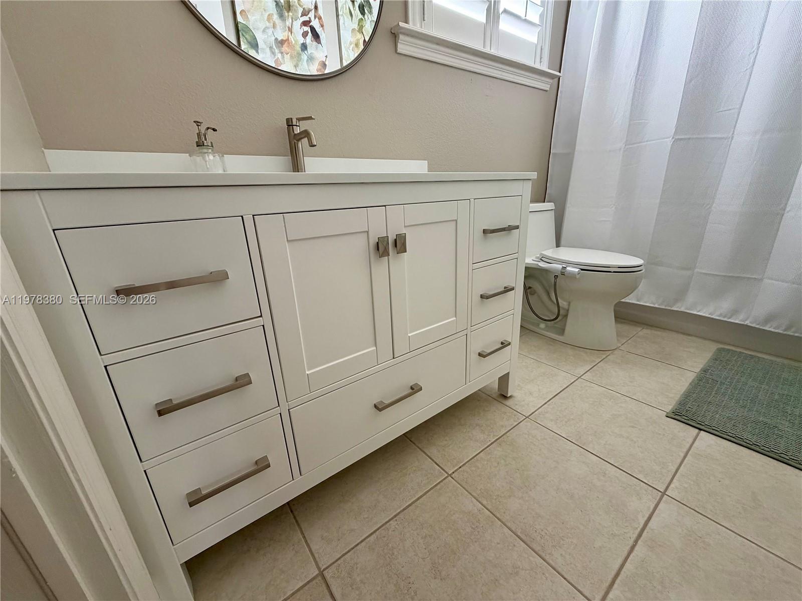 12391 Southwest 75th Street Miami, FL 33183 - Photo 63 of 89 a bathroom with a toilet and a sink