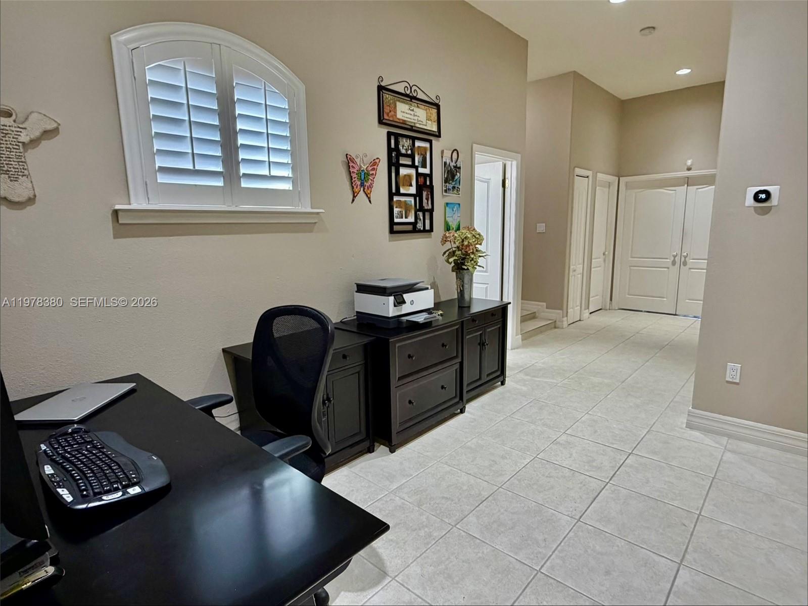 12391 Southwest 75th Street Miami, FL 33183 - Photo 67 of 89 a view of a workspace with furniture and a window