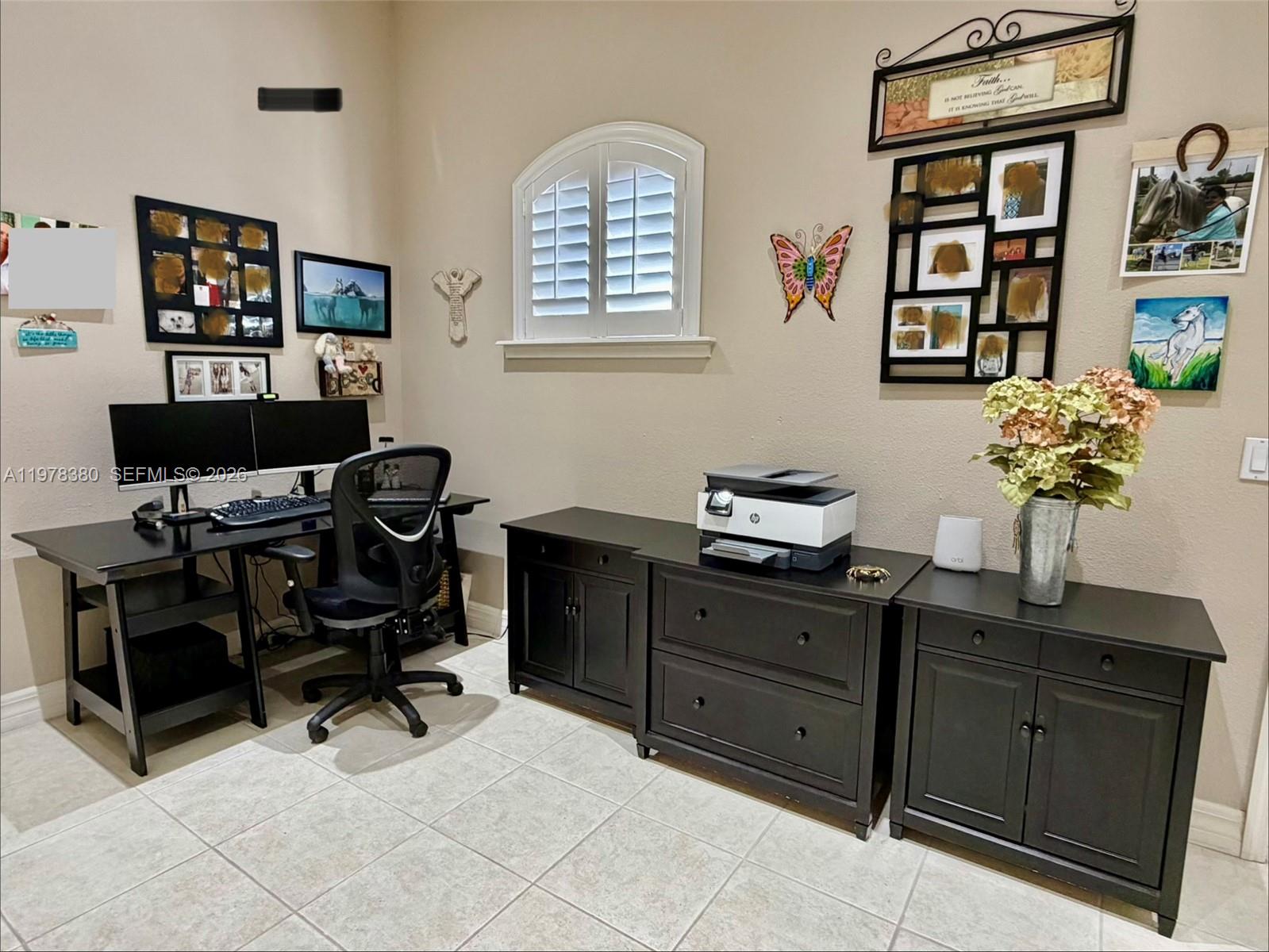 12391 Southwest 75th Street Miami, FL 33183 - Photo 68 of 89 a view of a workspace with furniture and a window