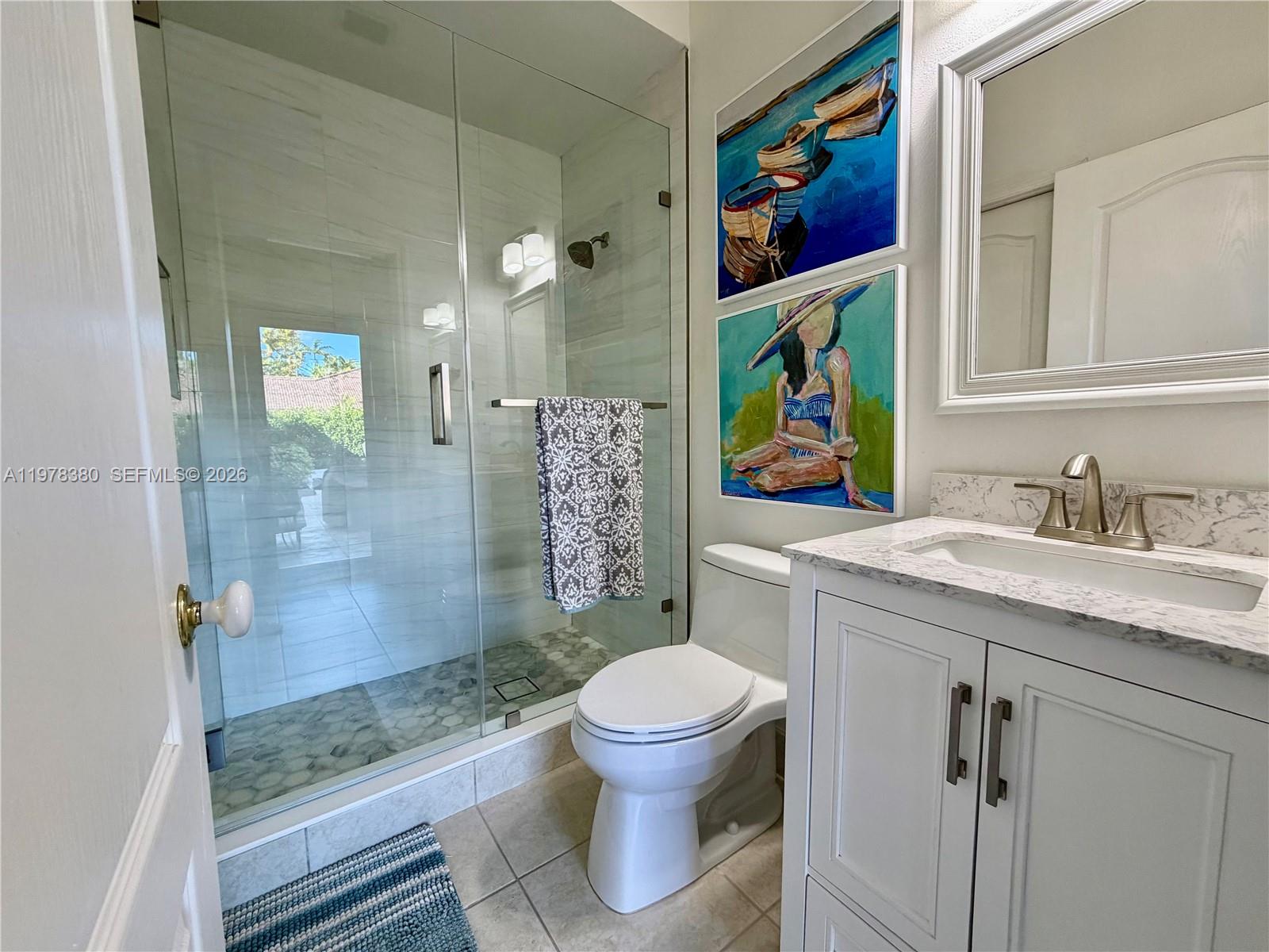 12391 Southwest 75th Street Miami, FL 33183 - Photo 72 of 89 a bathroom with a granite countertop sink toilet and shower
