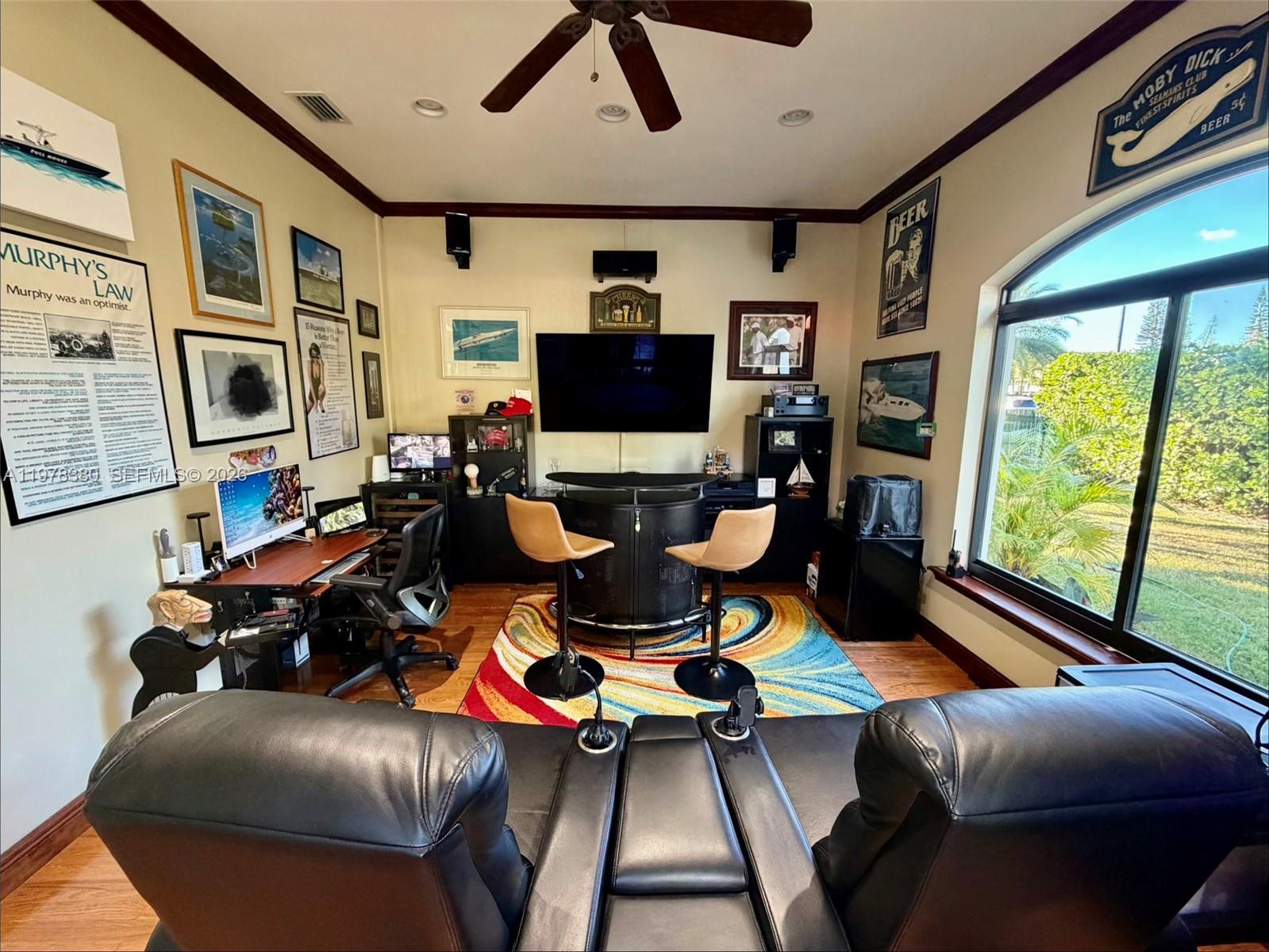 12391 Southwest 75th Street Miami, FL 33183 - Photo 75 of 89 a living room with furniture and a flat screen tv