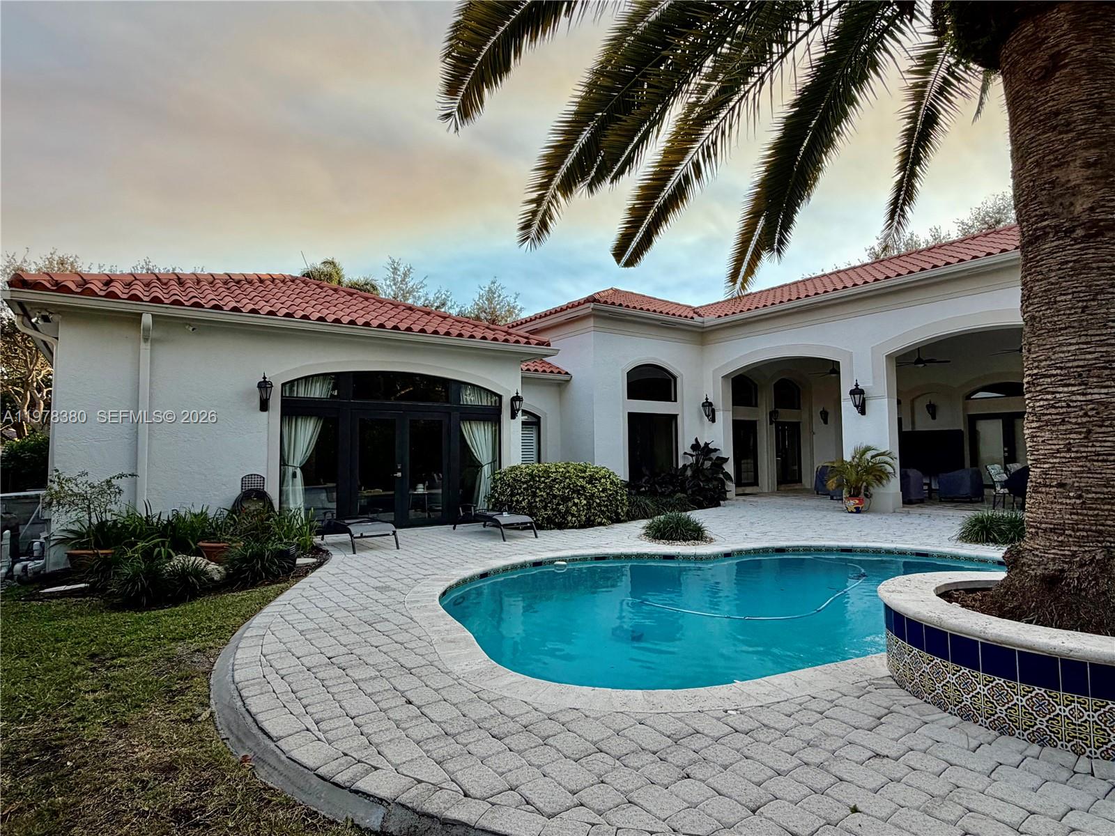 12391 Southwest 75th Street Miami, FL 33183 - Photo 84 of 89 a view of a house with swimming pool and furniture