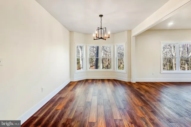 a kitchen with stainless steel appliances granite countertop a sink and a stove top oven