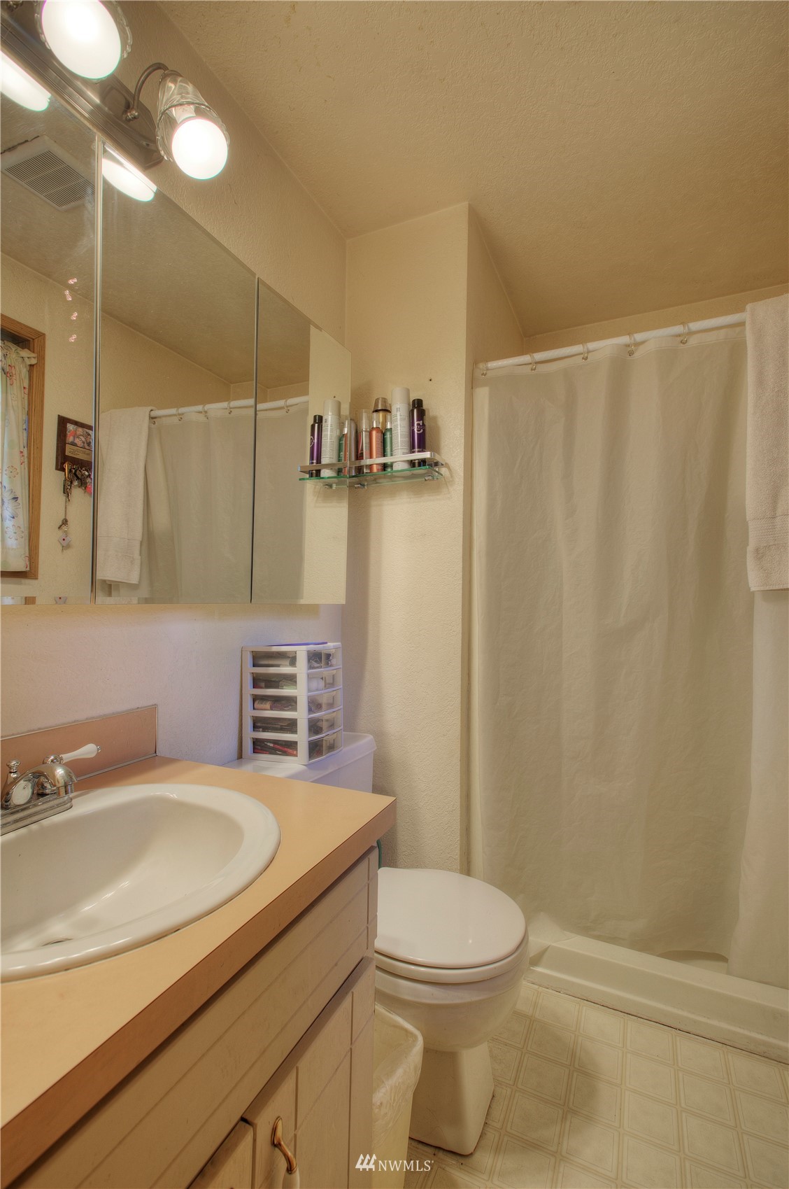 9216 South 239th Street Kent, WA 98031 - Photo 13 of 20 a bathroom with a granite countertop sink toilet and shower