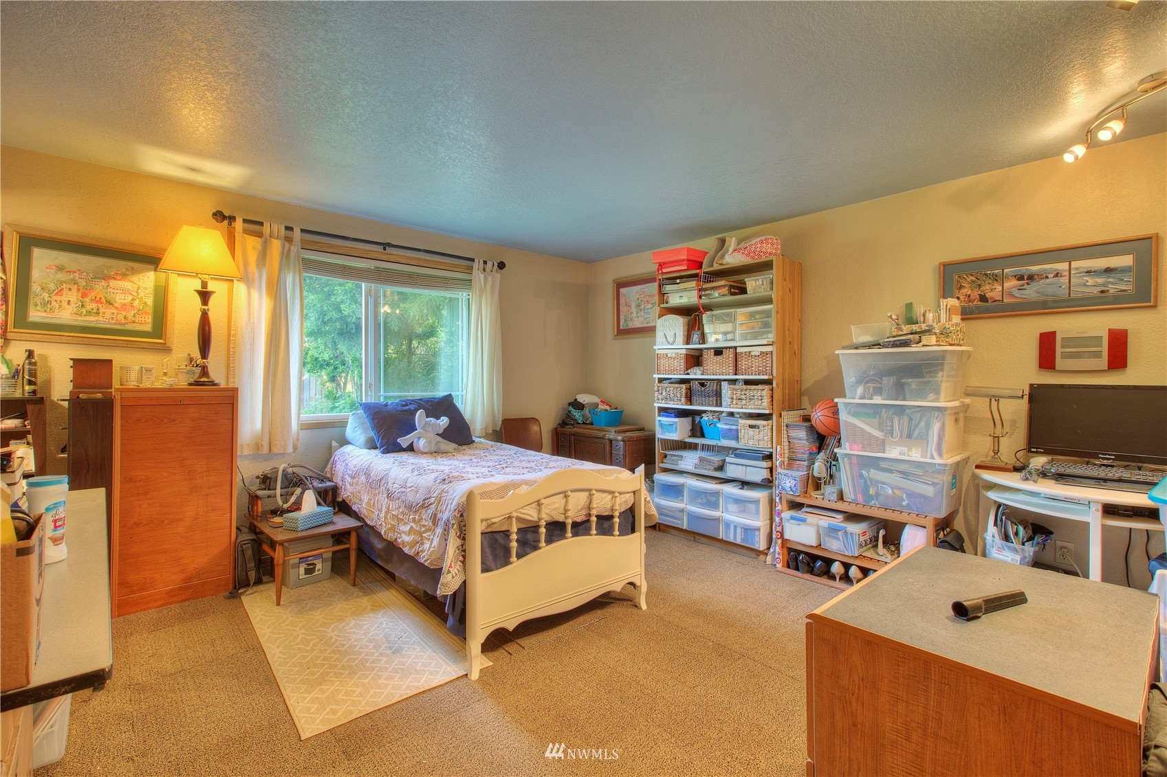 9216 South 239th Street Kent, WA 98031 - Photo 16 of 20 a bedroom with a bed furniture a desk and chair